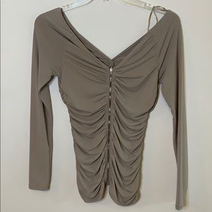 Tight ribbed off the shoulder long sleeve top.